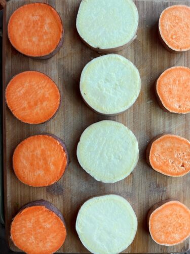 Assorted Sweet Potatoes on wood cutting board